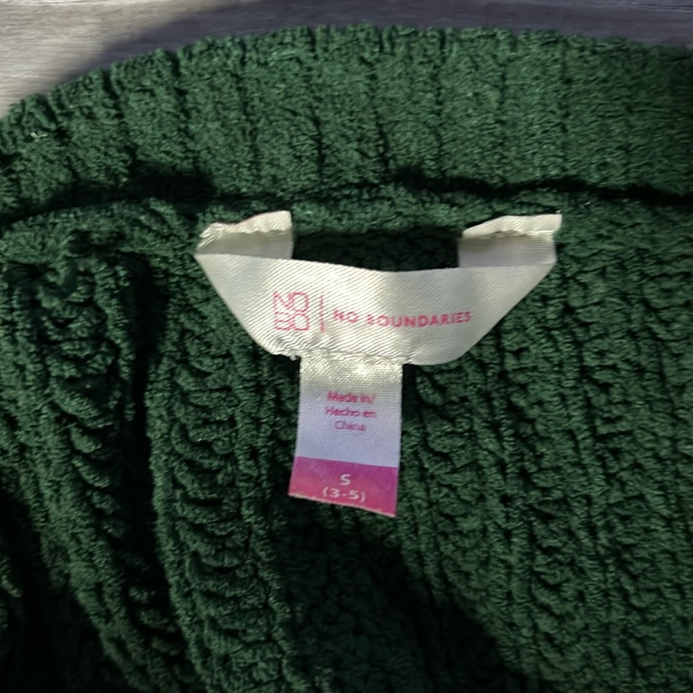 A knit green sweater from no boundaries in a size s